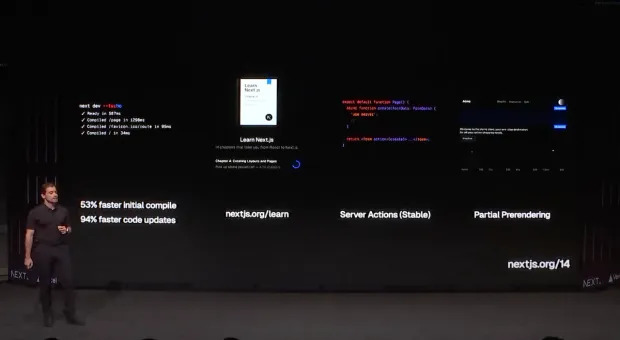 Guillermo Rauch ao lado de três telas grandes durante uma conferência técnica. A tela da esquerda exibe um código de computador destacando a melhoria de 53% na compilação inicial e 94% na rapidez das atualizações de código. O meio da tela mostra a página inicial de um site educativo para aprender sobre Next.js com a URL nextjs.org/learn. A tela da direita discute recursos do Next.js, como 'Server Actions (Estável)' e 'Partial Pre-rendering', com exemplos de código e a URL nextjs.org/14."