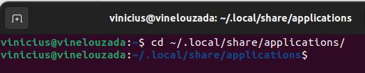 Imagem do terminal do Linux, com fundo de cor vinho. No terminal, estamos executando o comando para entrar na pasta “applications”. Como resultado, temos o terminal localizado nesta pasta.